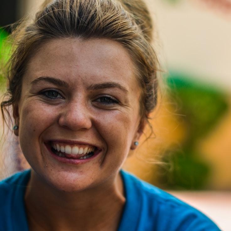 Alex Carter, Lead Design Curator at GardenFluxCrest, reviewing corporate floral arrangements